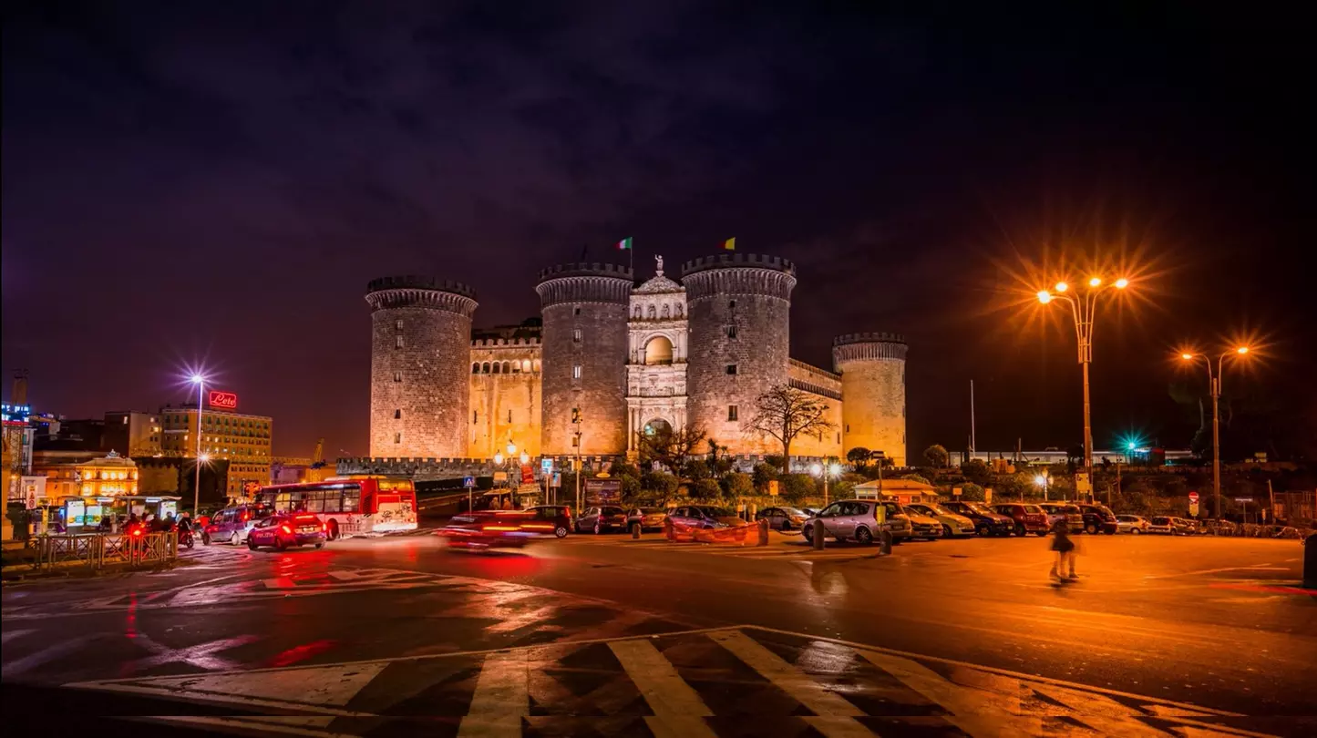 Traffic passing by, in front of the Maschio Angioino in Naples