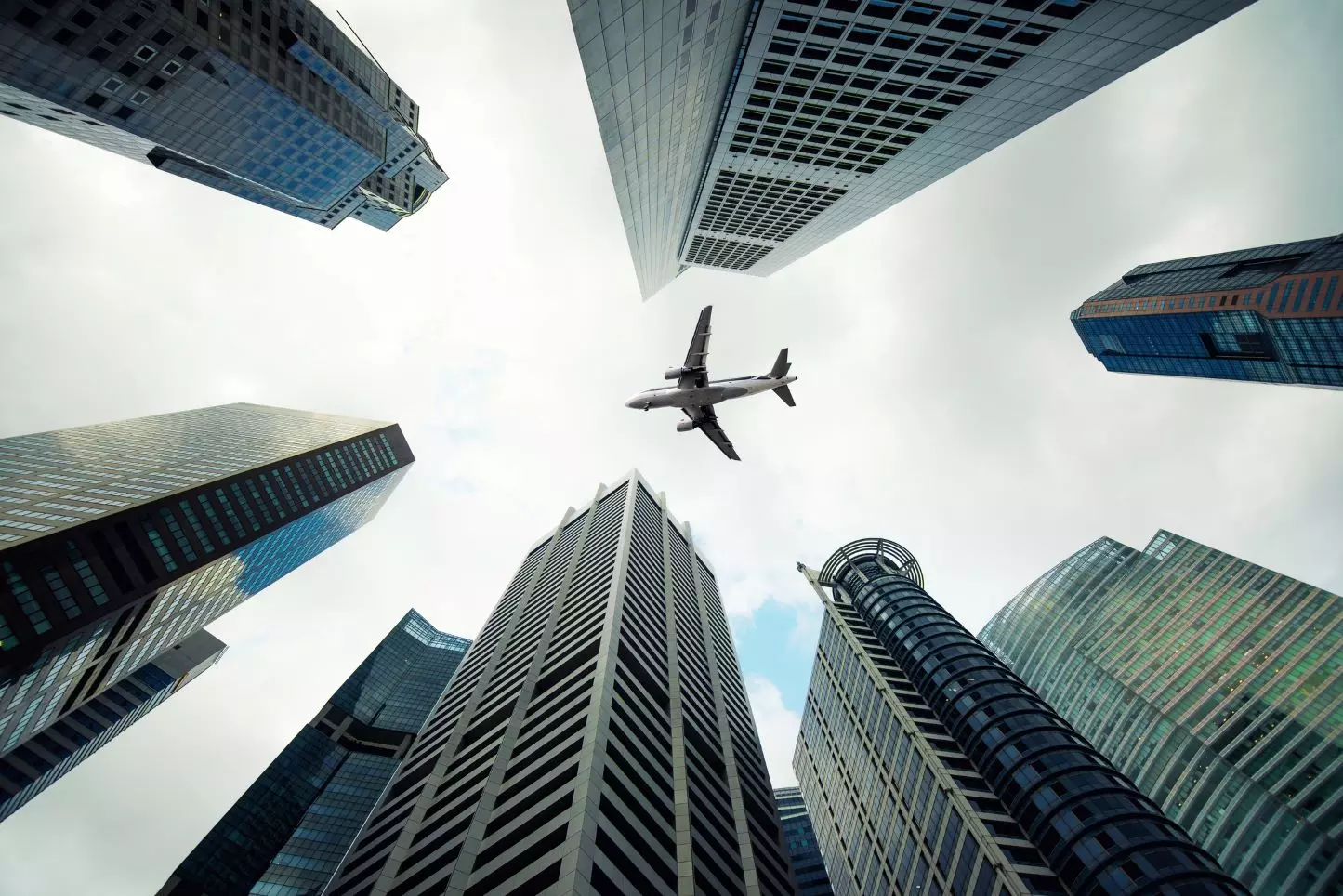 A plane flying over the city, in Singapore